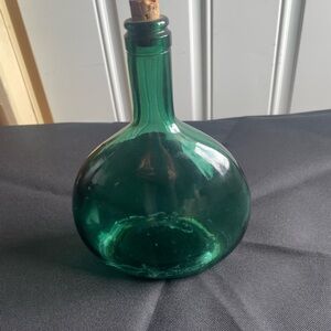 Old wine bottle - very vintage dark green - corked and marked.